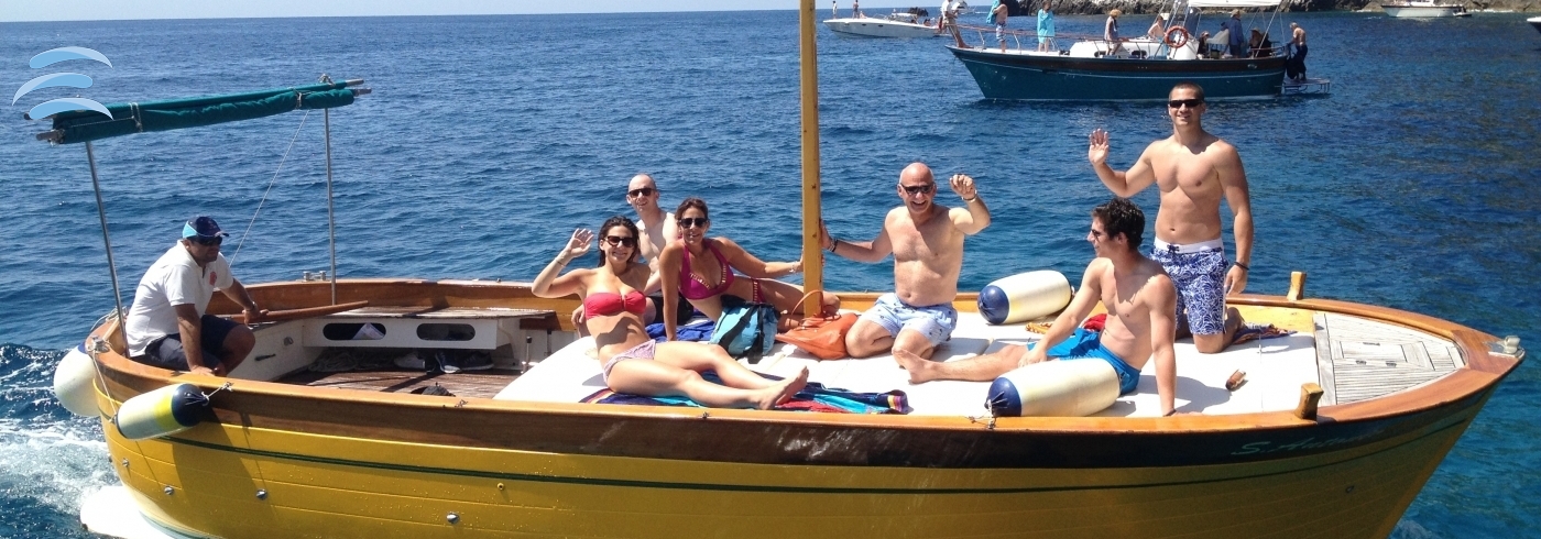 Small private boat cruising along the coast