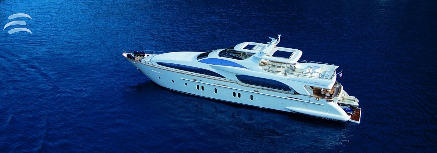 Private yacht cruising along the coastline