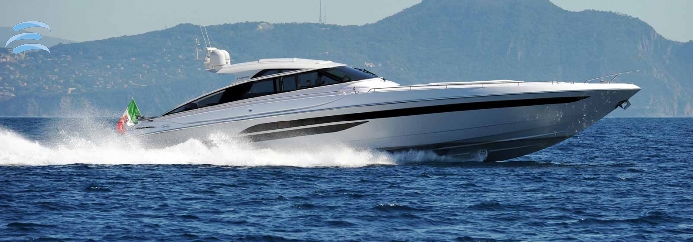 Private yacht cruising along the coastline