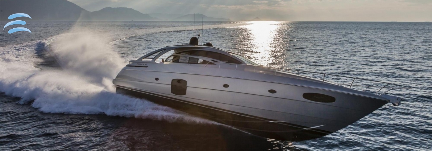 Private yacht cruising along the coastline