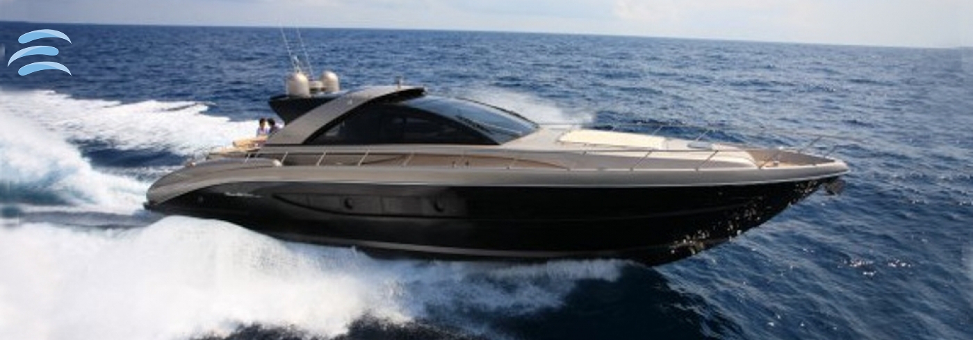 Private yacht cruising along the coastline