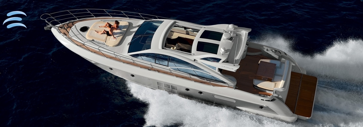 Private yacht cruising along the coastline